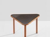 a close up of a table with a black top on a white surface