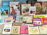 a lot of children ' s books that are on the table