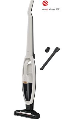 un aspirateur blanc et noir muni d'un cordon d'alimentation