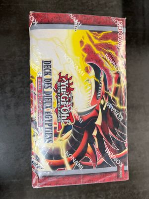 a close up of a box of pokemon trading cards on a table
