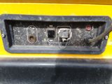 a close up view of the controls on the back end of a tractor