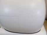 a large white object sitting on top of a wooden floor