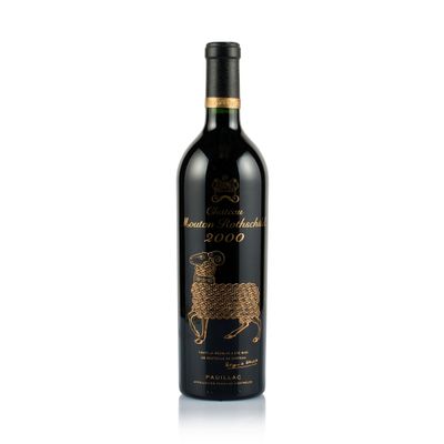 a bottle of red wine with a sheep design on it