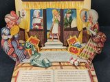 an open book with a picture of a woman reading a book