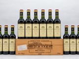 a group of six bottles of wine in a wooden box
