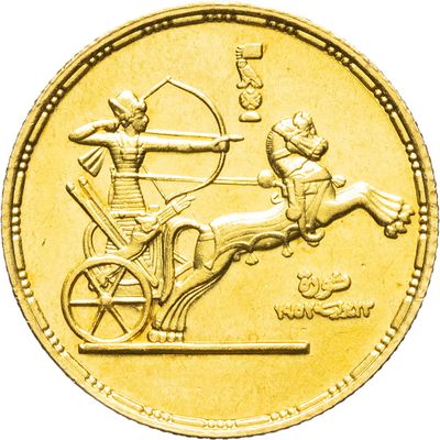 an image of a gold coin with an image of a man on a horse and carriage