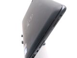 a black laptop sitting on top of a white table