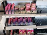 a lot of lip products on the shelves in the store