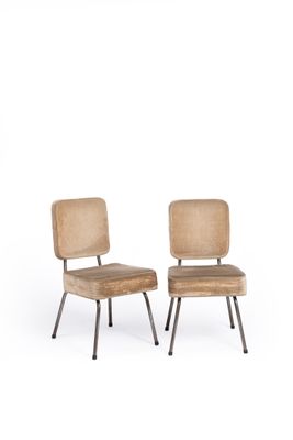 pair of mid - century chairs with upholstered backrests and metal legs