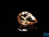 a close up of a diamond on a black surface