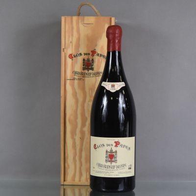 a bottle of wine sitting next to a wooden box