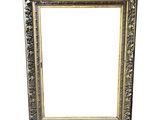 an old silver picture frame with a white background