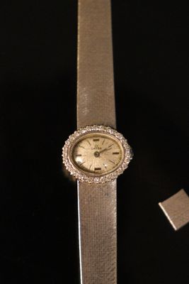 an image of a watch and a lighter on a table