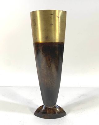 a vase that is sitting on a white surface