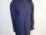 blue dress on a mannequin stand with a white background