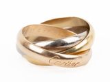 an image of a couple of gold rings on top of each other