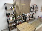 a desk and shelves in a room with various items on it