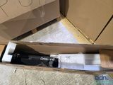 a box with a toothbrush inside of it on the floor