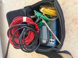 a bag filled with wires and wires on the ground