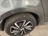 a close up of a car ' s tire on the ground