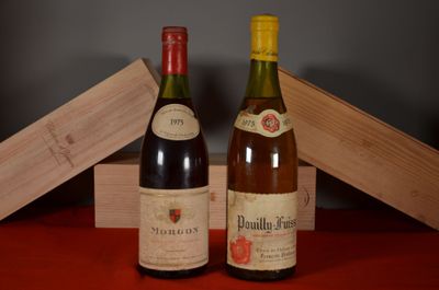 two bottles of wine sitting next to each other on a table