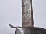 a close up of a knife with a handle on a table