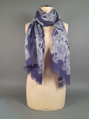 a purple and white scarf on a mannequin dummy