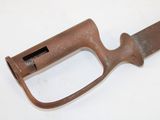 an old rusty knife with a handle on a white surface