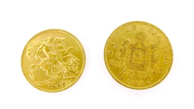 a close up of two gold coins on a white surface