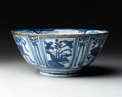 a blue and white bowl sitting on a table
