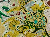 une peinture représentant un motif vert et jaune sur fond blanc