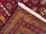 rugs and rugs are laid out on the floor next to a pair of shoes