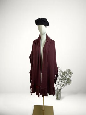 an image of a mannequin with a hat and scarf
