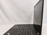 the back of a laptop computer sitting on top of a white table