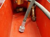 a close up of a hose connected to a fire hydrant