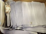 a box full of papers that are sitting on a table
