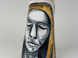 a vase with a painting of a woman on it