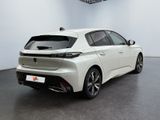 the rear view of a white car in a showroom