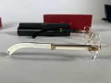 glasses with gold rims and clear frames on a white surface