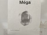 a sign that says suspension mega on the toilet