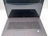 a laptop that is open and sitting on a table