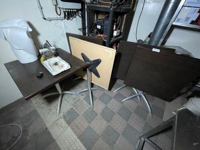 a small table with a picture on it and a toilet in the background