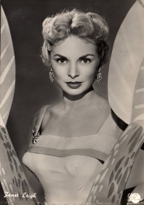 an old black and white photo of a woman in a bikini top