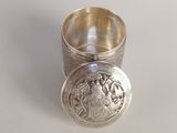 a silver ring that has a picture of a woman on it