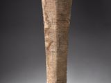 an image of a tall wooden vase on a black background