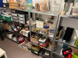 a room filled with lots of clutter and craft supplies