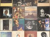 a lot of records on the wall of a room