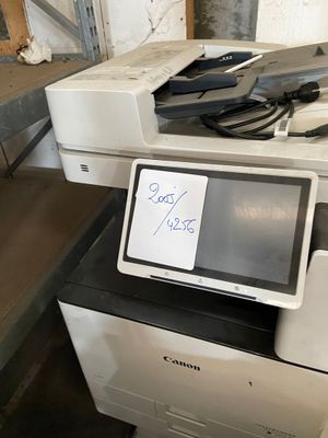 a photo of a printer sitting on top of a counter