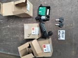 several boxes and a pair of scissors sitting on the ground