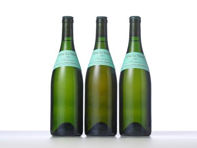 three bottles of wine that are sitting on a table